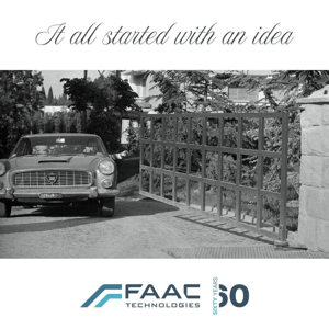 black and white picture of an automated gate and a car